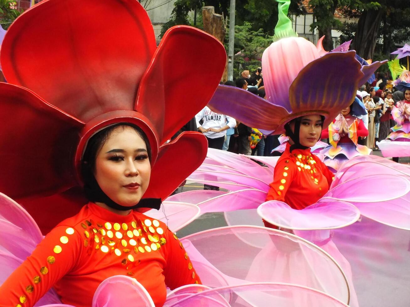Surakarta City, Central Java, Indonesia, May 15, 2024. Tourist attraction on a traditional costume parade at Slamet Riyadi Street. photo