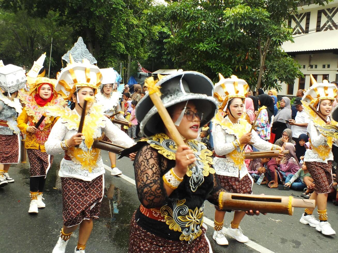 Surakarta City, Central Java, Indonesia, May 15, 2024. Tourist attraction on a traditional costume parade at Slamet Riyadi Street. photo