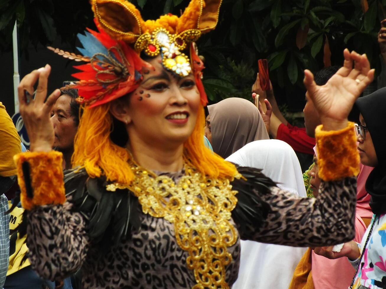 Surakarta City, Central Java, Indonesia, May 15, 2024. Tourist attraction on a traditional costume parade at Slamet Riyadi Street. photo