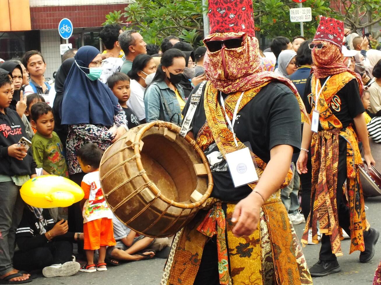 Surakarta City, Central Java, Indonesia, May 15, 2024. Tourist attraction on a traditional costume parade at Slamet Riyadi Street. photo