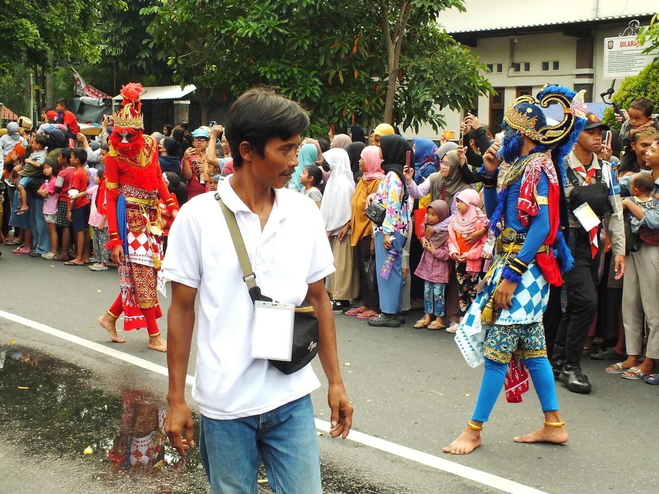 Surakarta City, Central Java, Indonesia, May 15, 2024. Tourist attraction on a traditional costume parade at Slamet Riyadi Street. photo