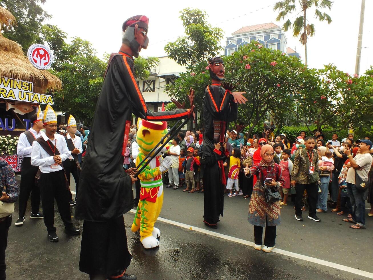 Surakarta City, Central Java, Indonesia, May 15, 2024. Tourist attraction on a traditional costume parade at Slamet Riyadi Street. photo