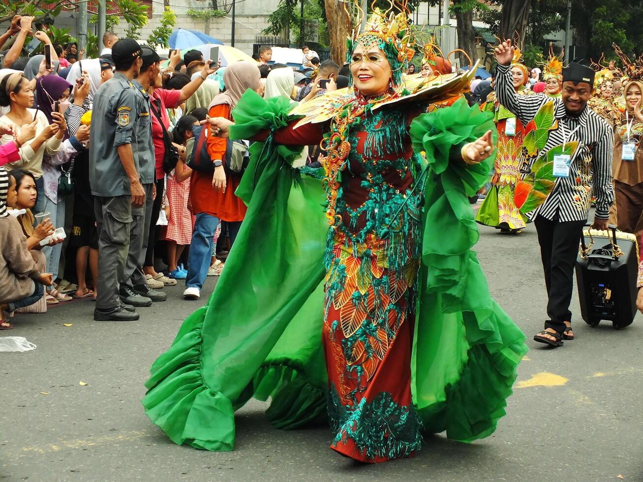 Surakarta City, Central Java, Indonesia, May 15, 2024. Tourist attraction on a traditional costume parade at Slamet Riyadi Street. photo