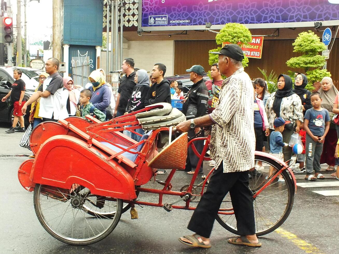Surakarta City, Central Java, Indonesia, May 15, 2024. Crowd people watching a parade at Slamet Riyadi Street. photo