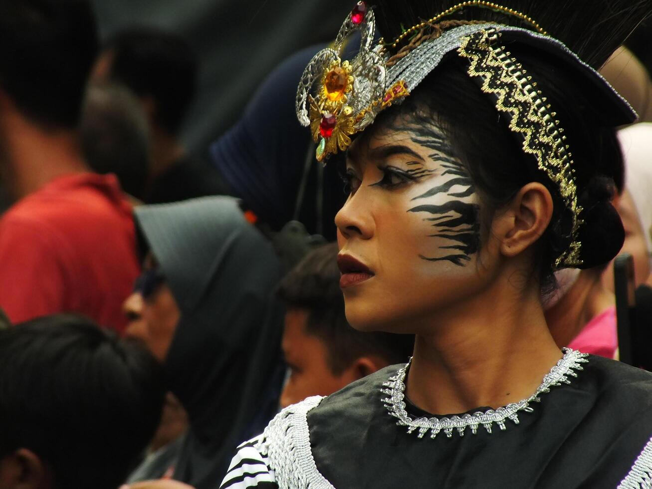 Surakarta City, Central Java, Indonesia, May 15, 2024. Tourist attraction on a traditional costume parade at Slamet Riyadi Street. photo
