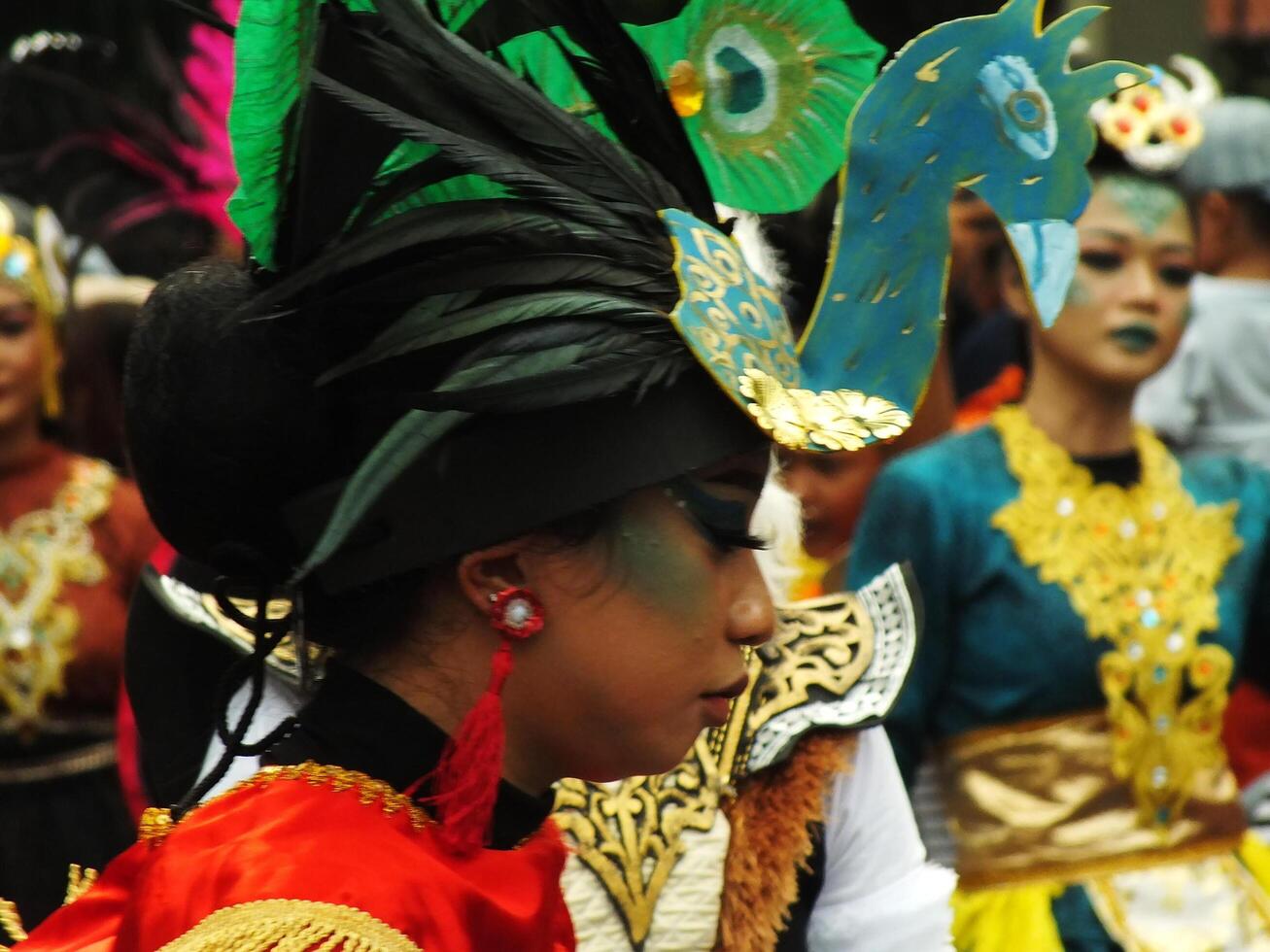 Surakarta City, Central Java, Indonesia, May 15, 2024. Tourist attraction on a traditional costume parade at Slamet Riyadi Street. photo
