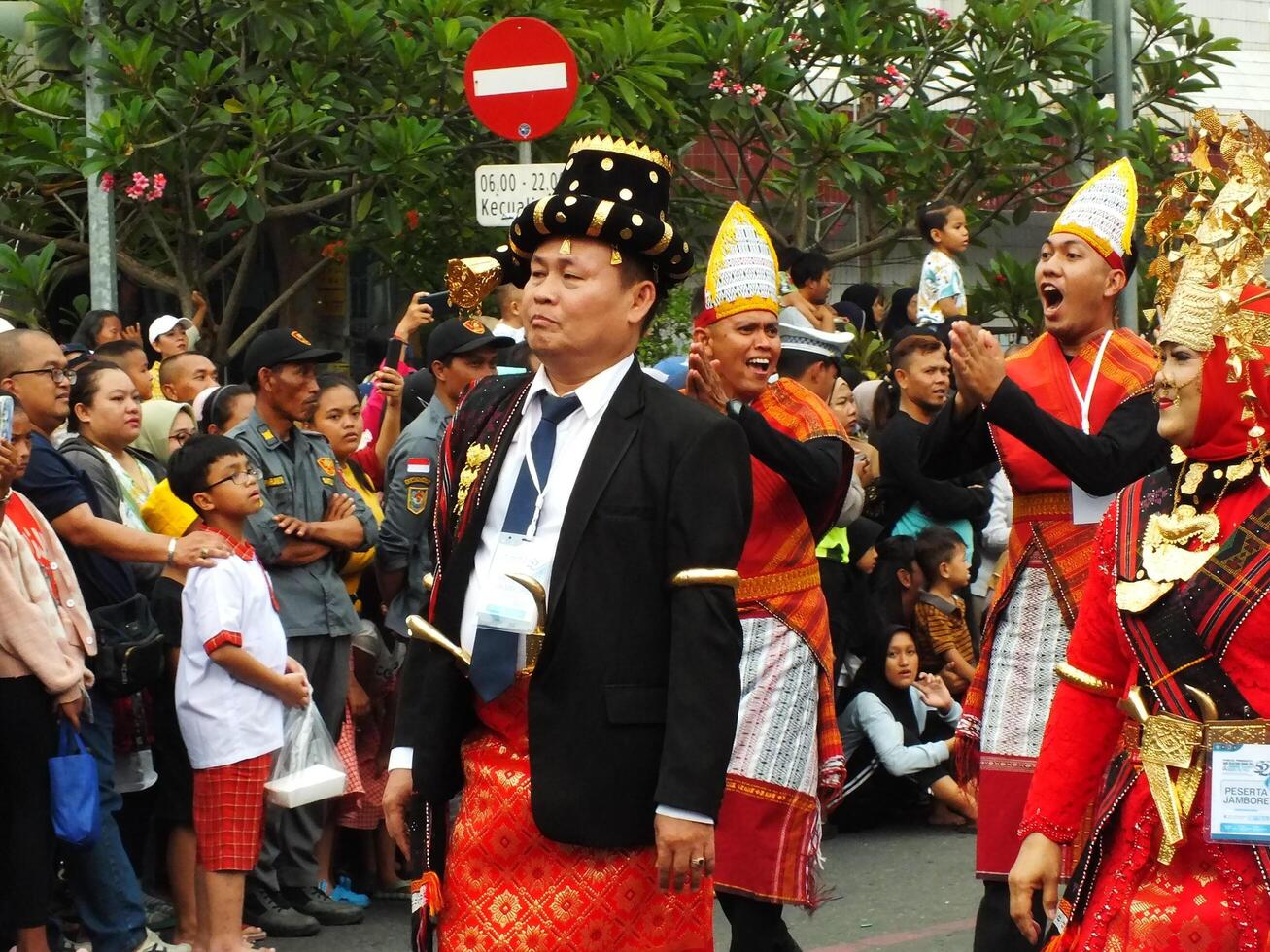 Surakarta City, Central Java, Indonesia, May 15, 2024. Tourist attraction on a traditional costume parade at Slamet Riyadi Street. photo