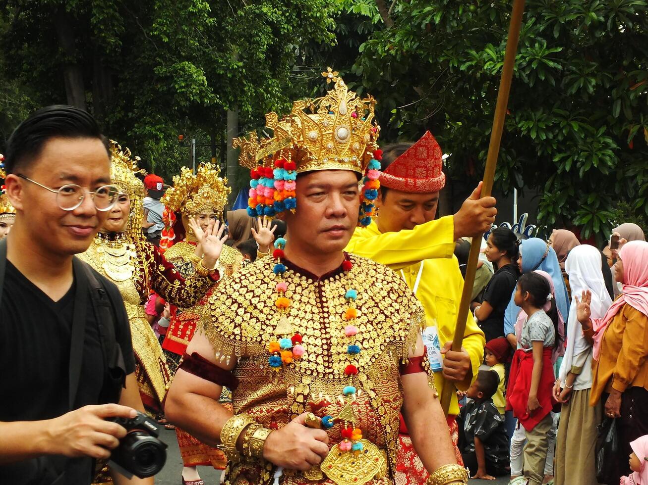 Surakarta City, Central Java, Indonesia, May 15, 2024. Tourist attraction on a traditional costume parade at Slamet Riyadi Street. photo