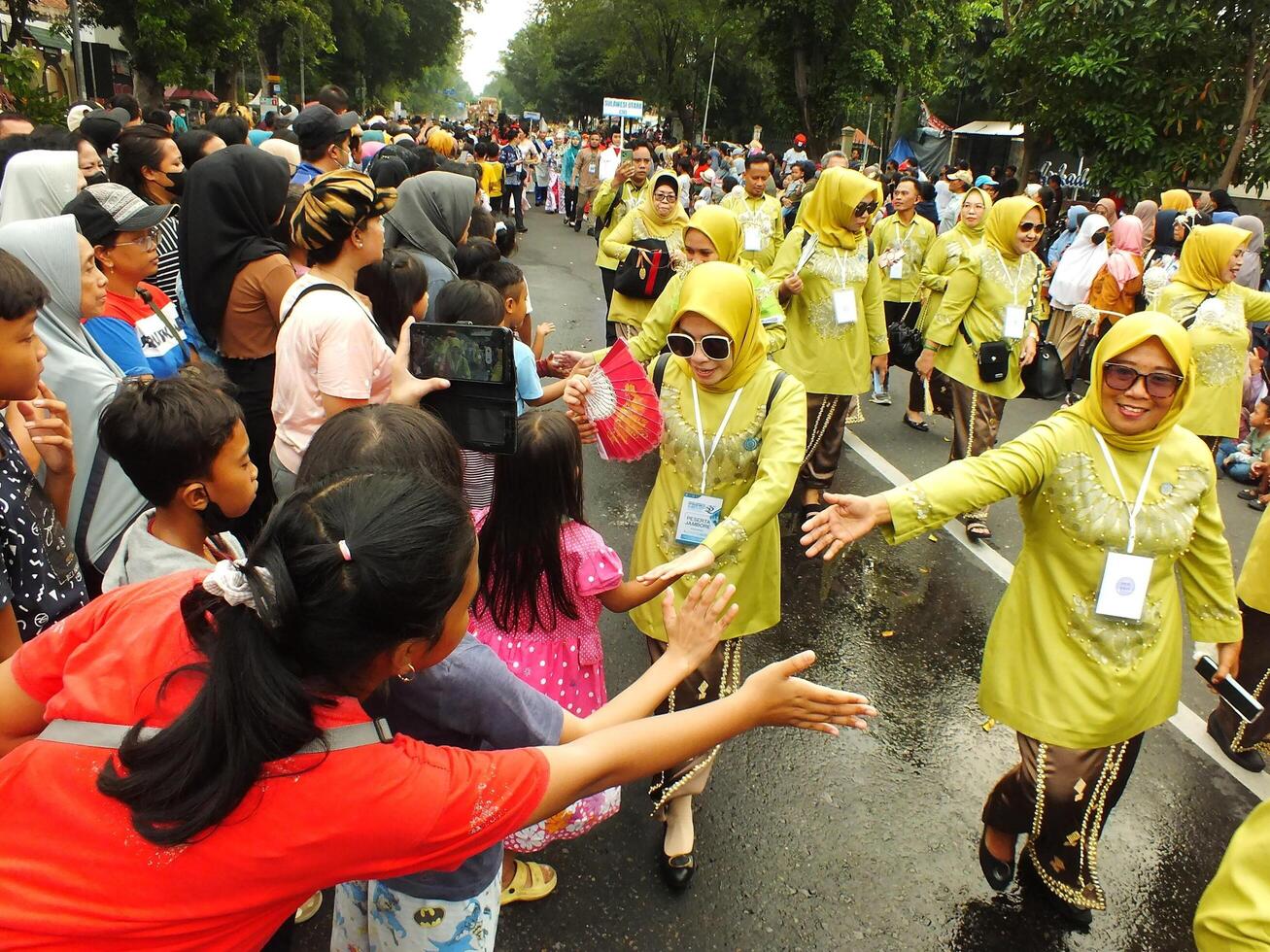 Surakarta City, Central Java, Indonesia, May 15, 2024. Tourist attraction on a traditional costume parade at Slamet Riyadi Street. photo