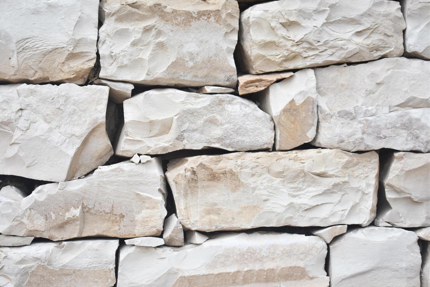 Natural White Stone Wall Background. Stone Background. White Stone Background Texture. photo