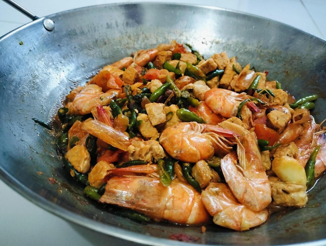 Stir-fry tempeh shrimp, focus of Spicy tempeh cooked in Indonesian styles. Stir fried slicy tempeh,seasoning with shrimp paste with chilies photo
