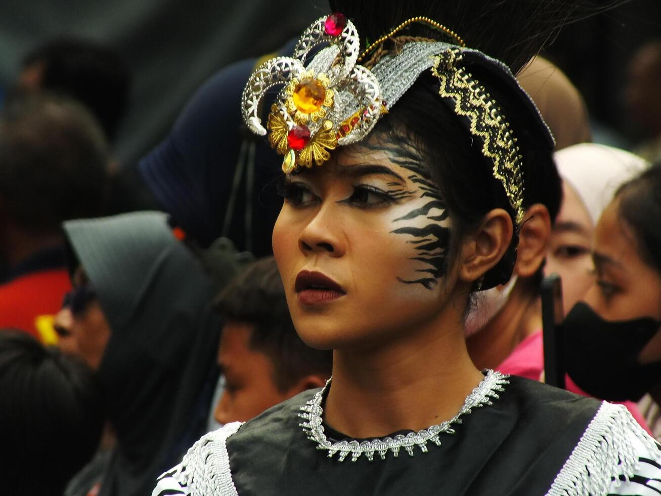 Surakarta City, Central Java, Indonesia, May 15, 2024. Tourist attraction on a traditional costume parade at Slamet Riyadi Street. photo