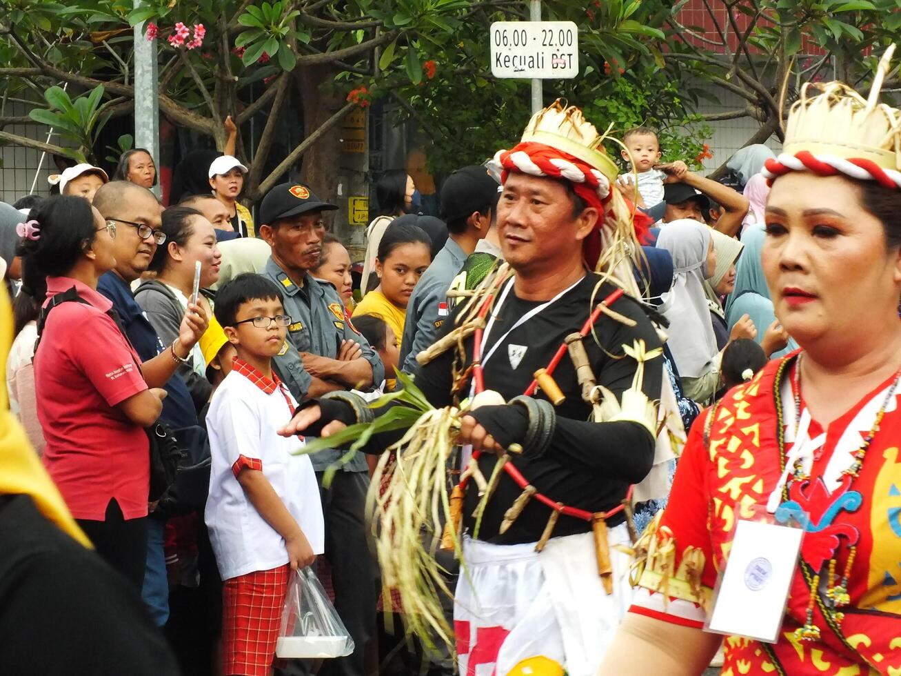 Surakarta City, Central Java, Indonesia, May 15, 2024. Tourist attraction on a traditional costume parade at Slamet Riyadi Street. photo