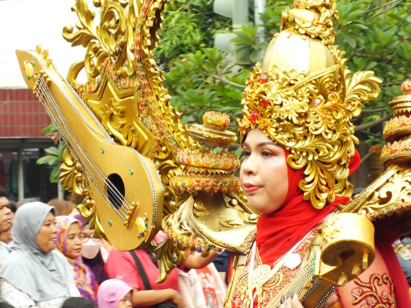 Surakarta City, Central Java, Indonesia, May 15, 2024. Tourist attraction on a traditional costume parade at Slamet Riyadi Street. photo
