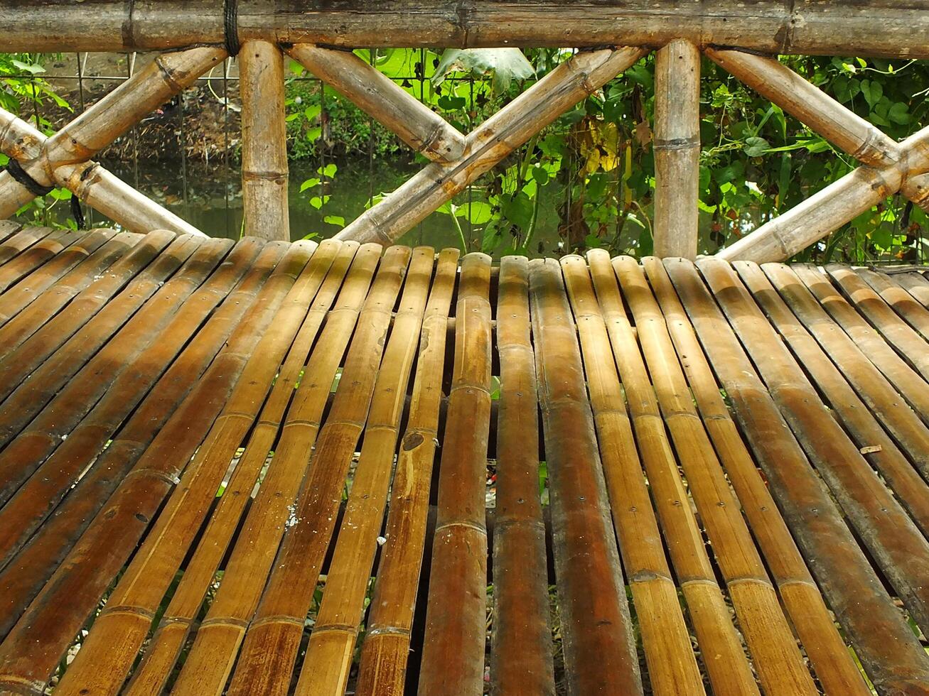 Traditional Bamboo Gazebo in shade under the trees. a relaxing place to unwind photo