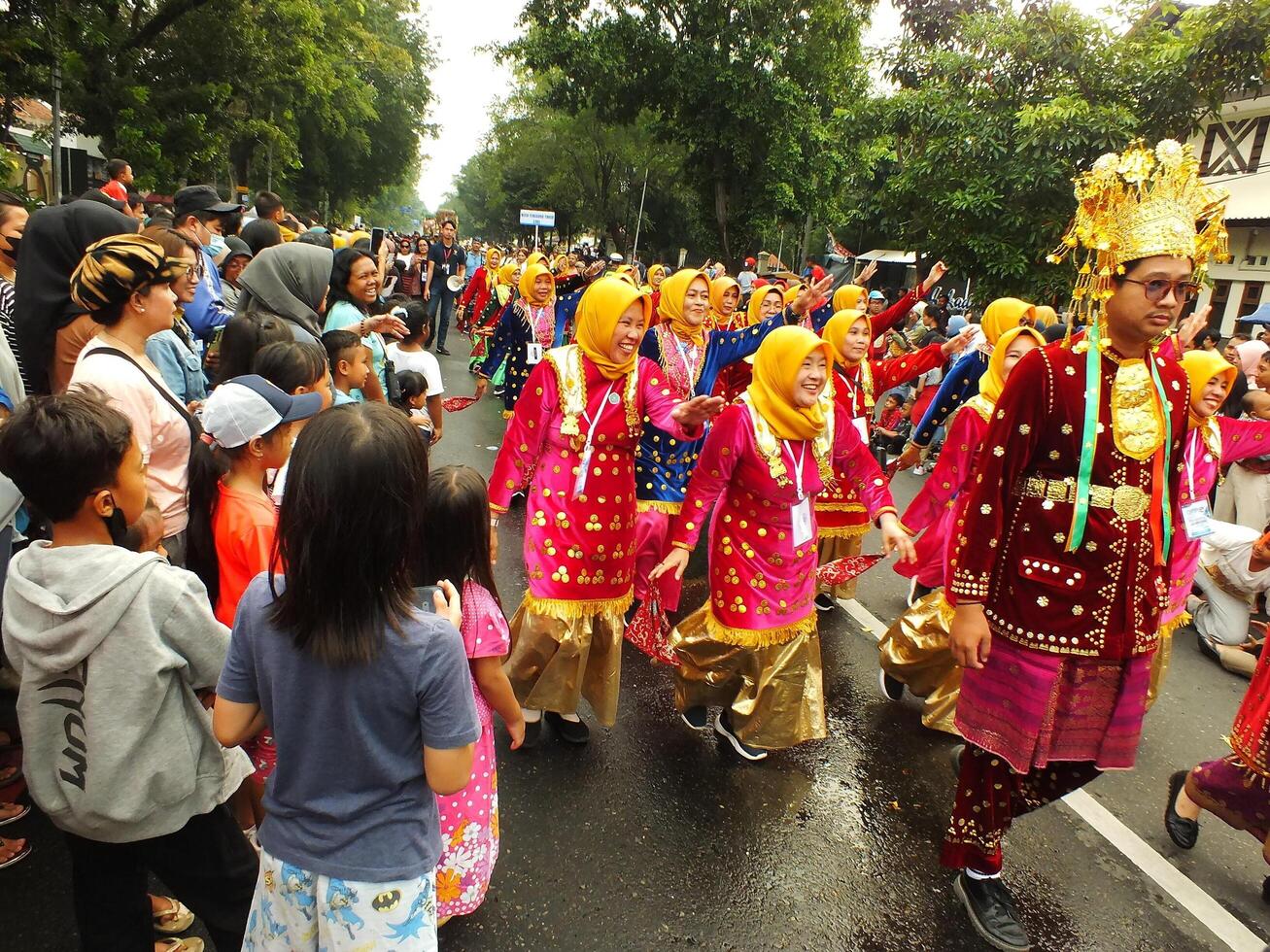 Surakarta City, Central Java, Indonesia, May 15, 2024. Tourist attraction on a traditional costume parade at Slamet Riyadi Street. photo