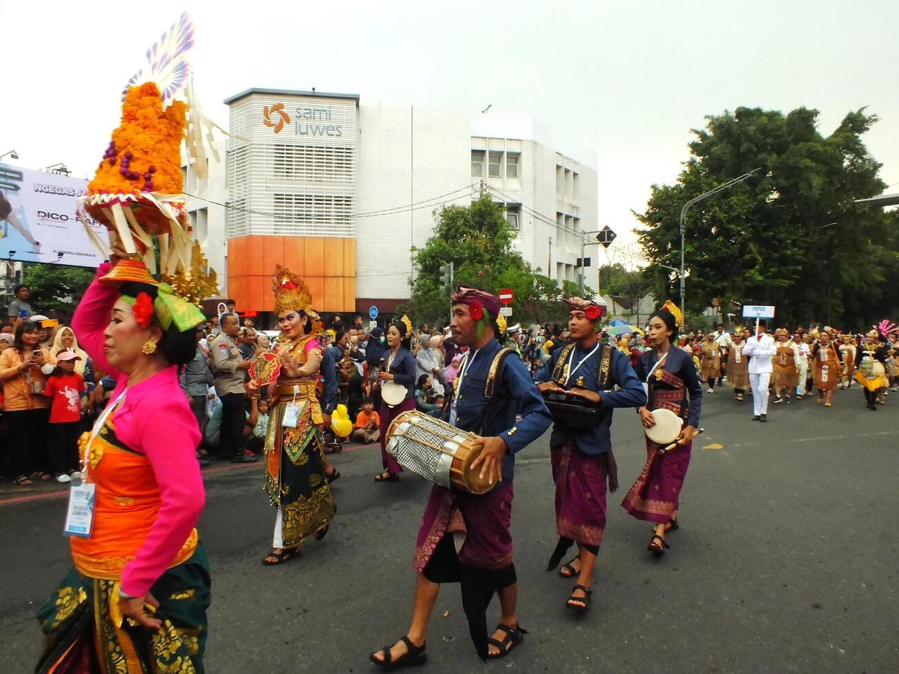 Surakarta City, Central Java, Indonesia, May 15, 2024. Tourist attraction on a traditional costume parade at Slamet Riyadi Street. photo