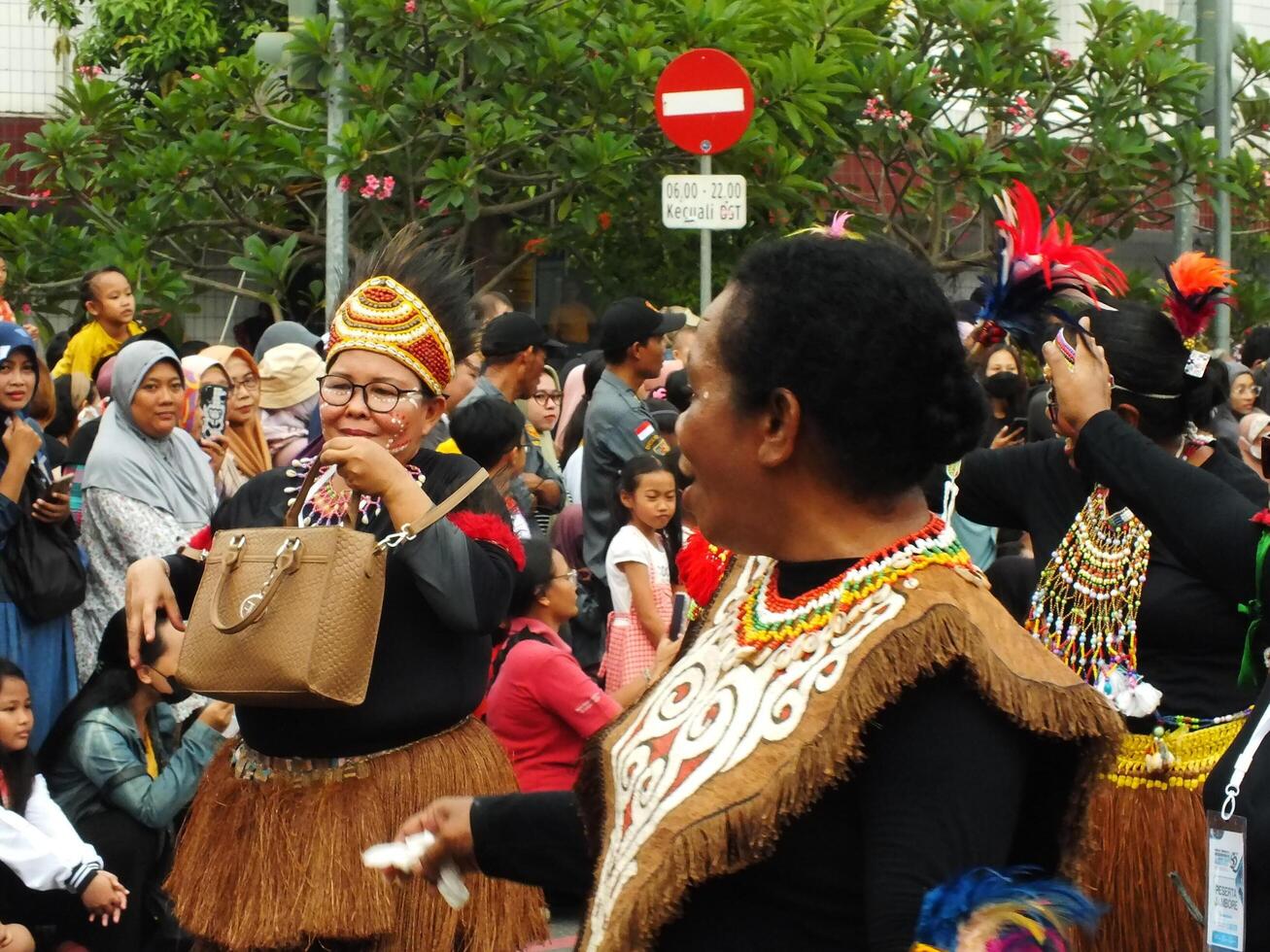 Surakarta City, Central Java, Indonesia, May 15, 2024. Tourist attraction on a traditional costume parade at Slamet Riyadi Street. photo