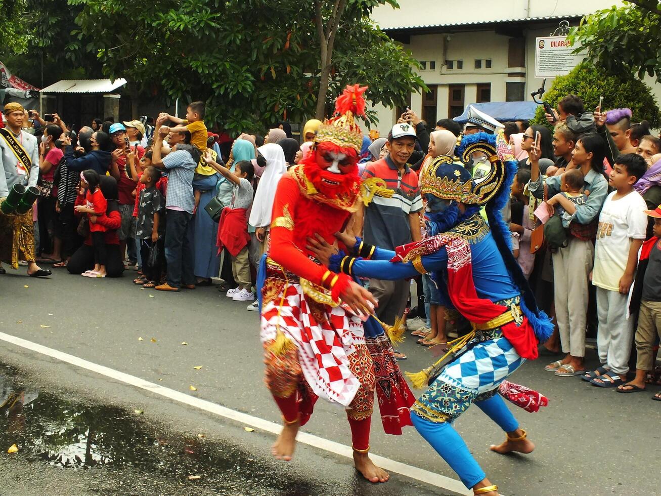 Surakarta City, Central Java, Indonesia, May 15, 2024. Tourist attraction on a traditional costume parade at Slamet Riyadi Street. photo