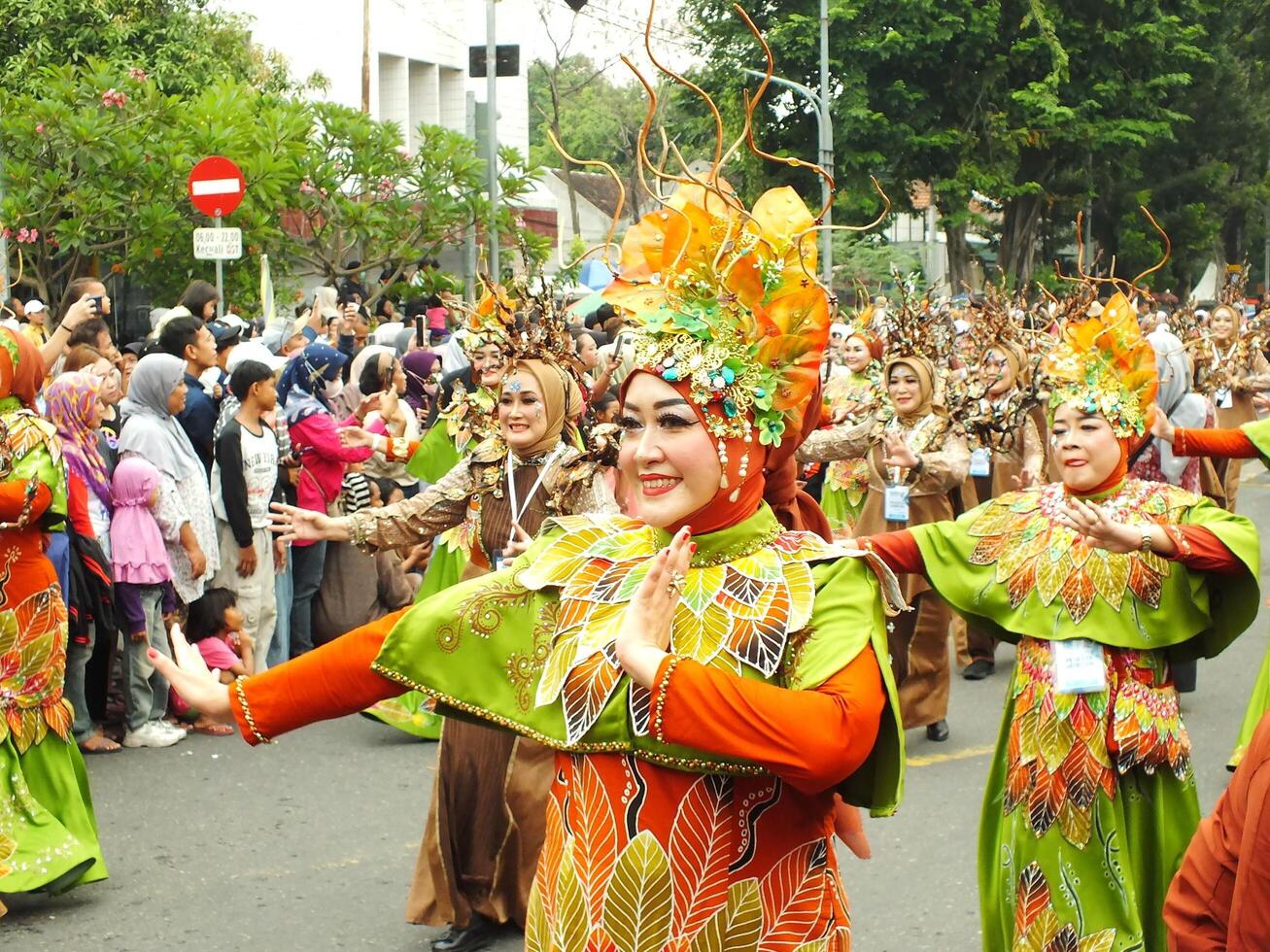 Surakarta City, Central Java, Indonesia, May 15, 2024. Tourist attraction on a traditional costume parade at Slamet Riyadi Street. photo