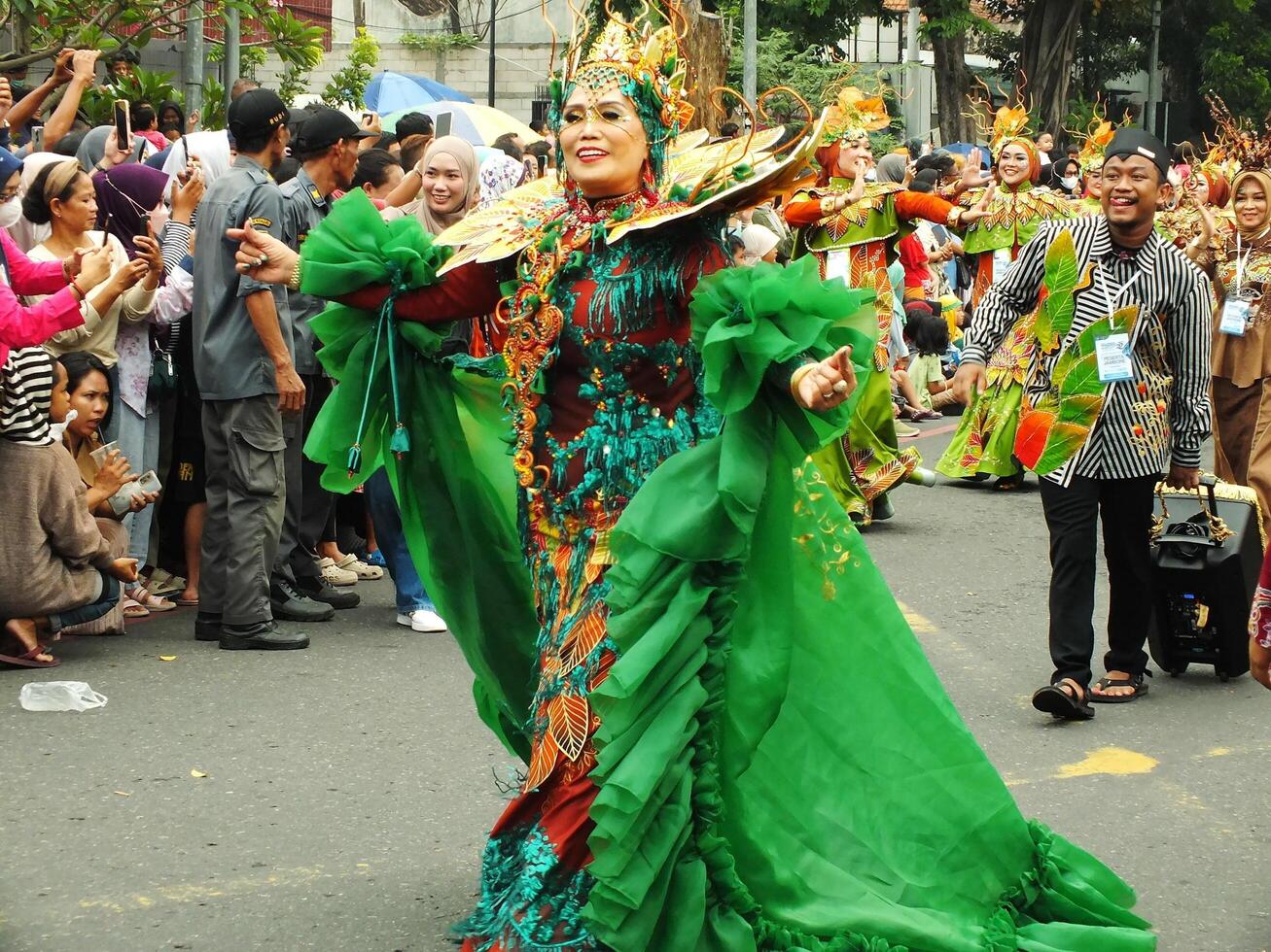 Surakarta City, Central Java, Indonesia, May 15, 2024. Tourist attraction on a traditional costume parade at Slamet Riyadi Street. photo