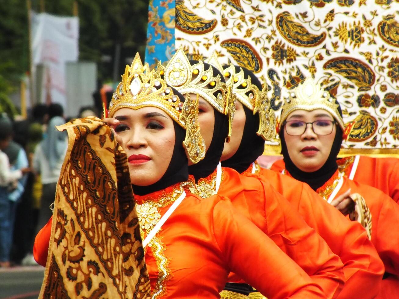 Surakarta City, Central Java, Indonesia, May 15, 2024. Tourist attraction on a traditional costume parade at Slamet Riyadi Street. photo