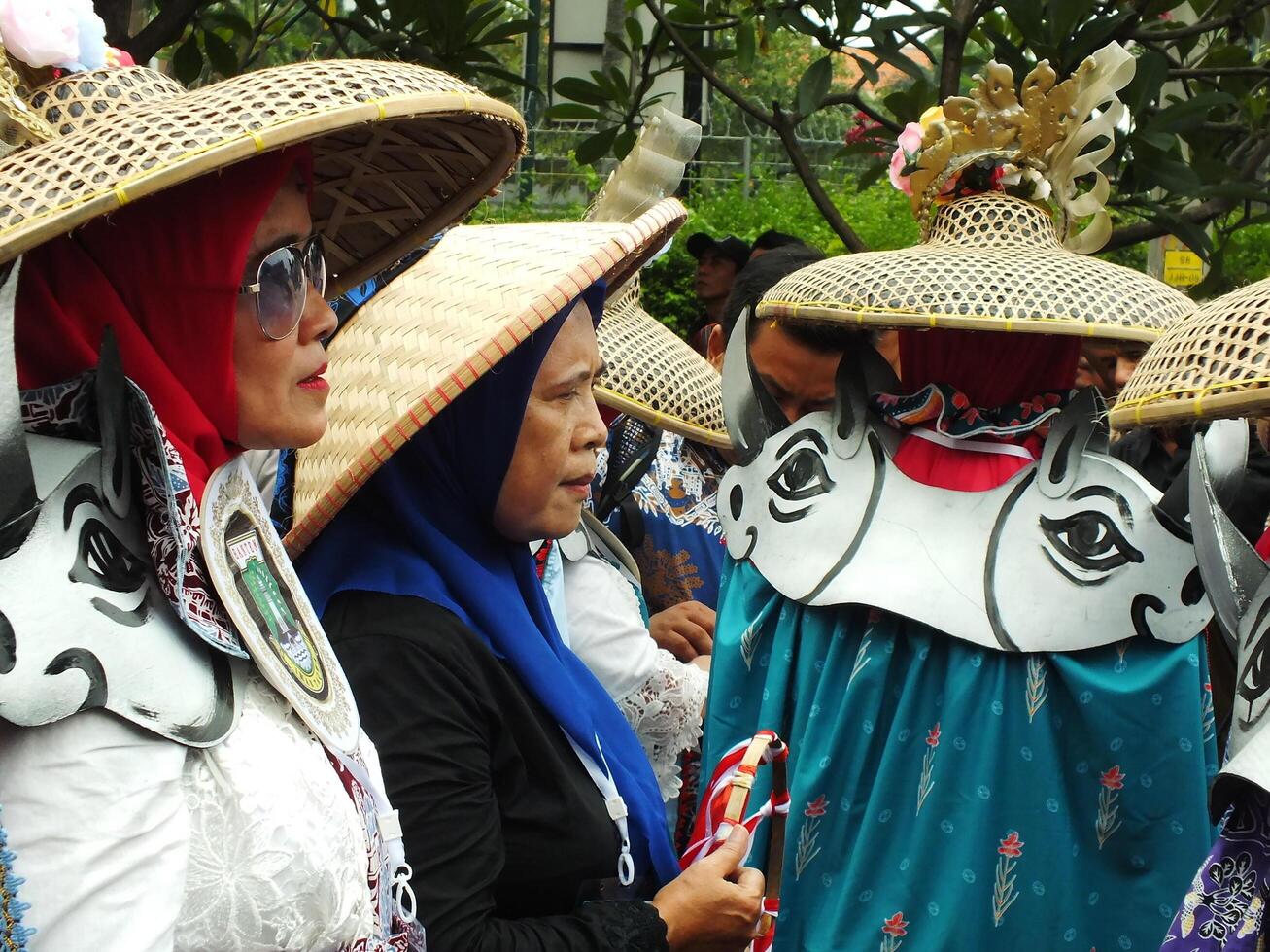 Surakarta City, Central Java, Indonesia, May 15, 2024. Tourist attraction on a traditional costume parade at Slamet Riyadi Street. photo