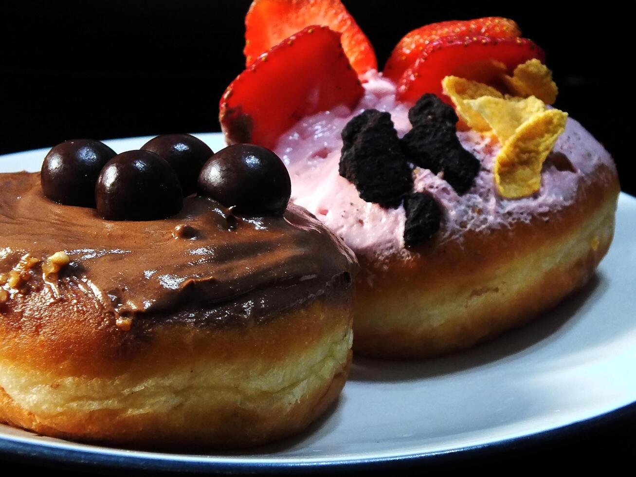Sweet cake with various topping and sugar cream. Appetizer isolated on black background. Food and beverage image for coffee shop and restaurant business photo