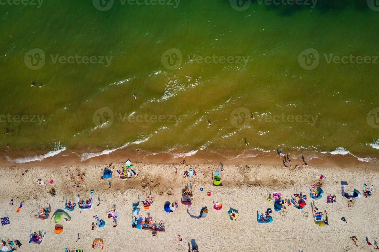 Aerial view of Baltic Sea beach with swimming people in Wladyslawowo, Poland photo