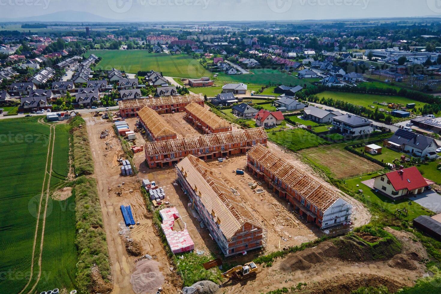 Aerial view of new house construction project in suburban area. photo
