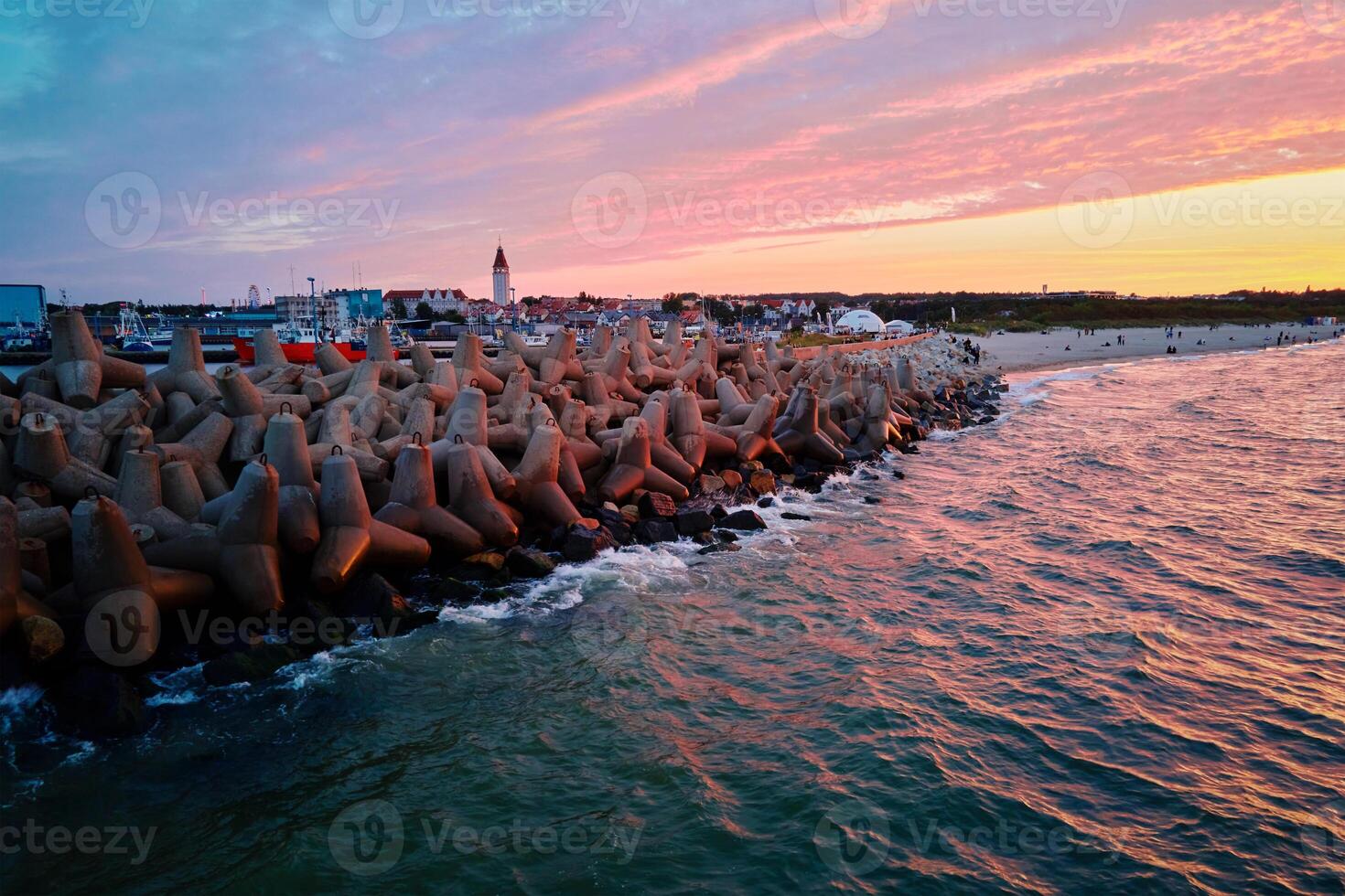 Tetrapod breakwater at sea coast for protecting from waves photo