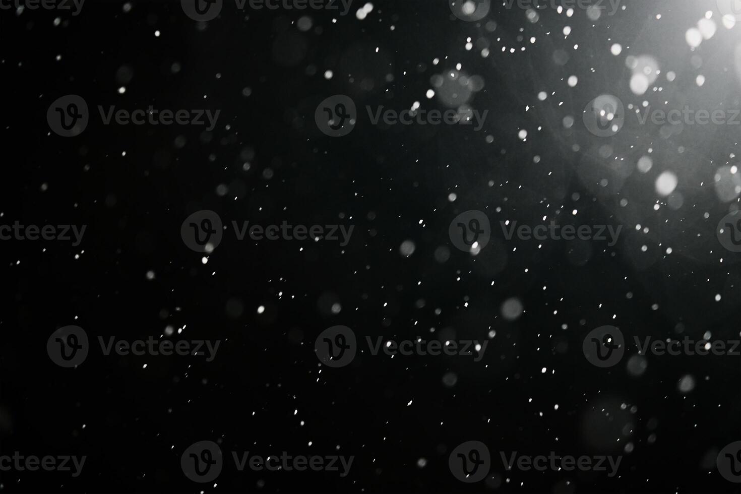 Falling snowflakes on dark background. photo