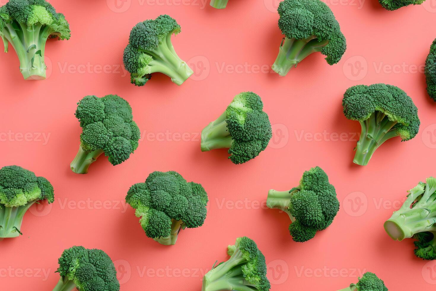 Pattern with Fresh Green Broccoli Florets on Red Background photo