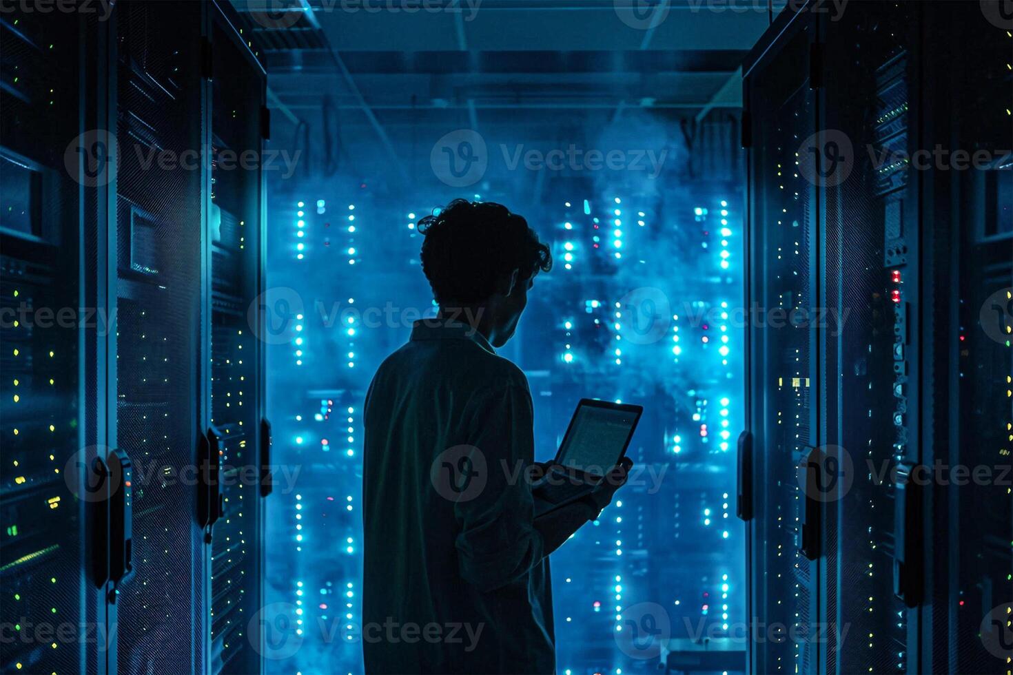 Man standing in front of a data centre checking the database photo