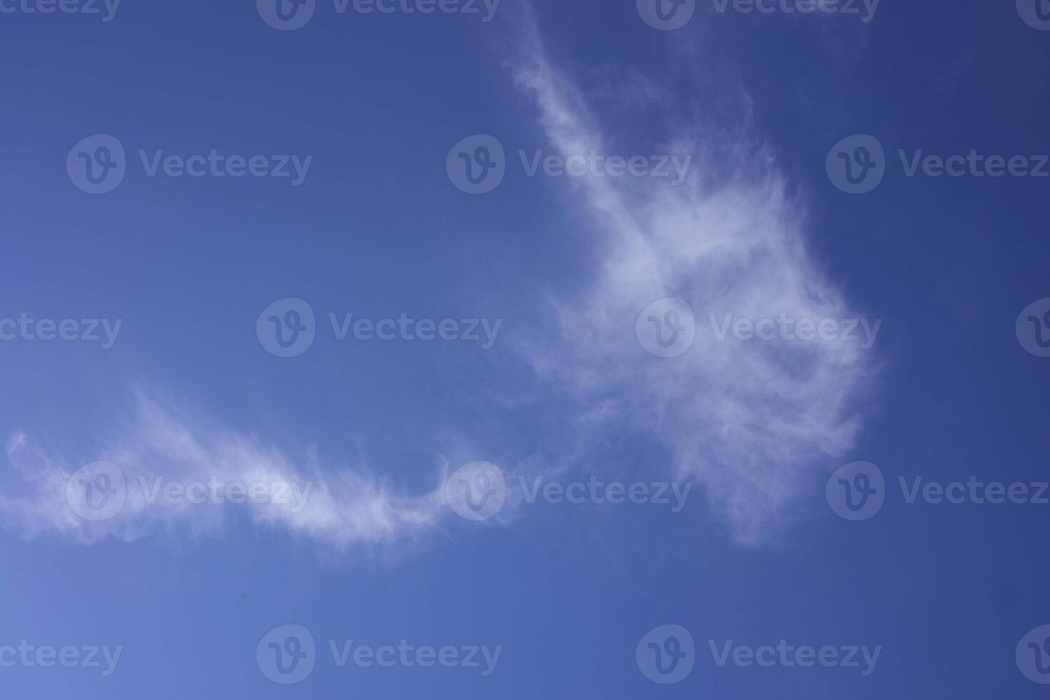 the sky on a summer day with white cirrus clouds photo