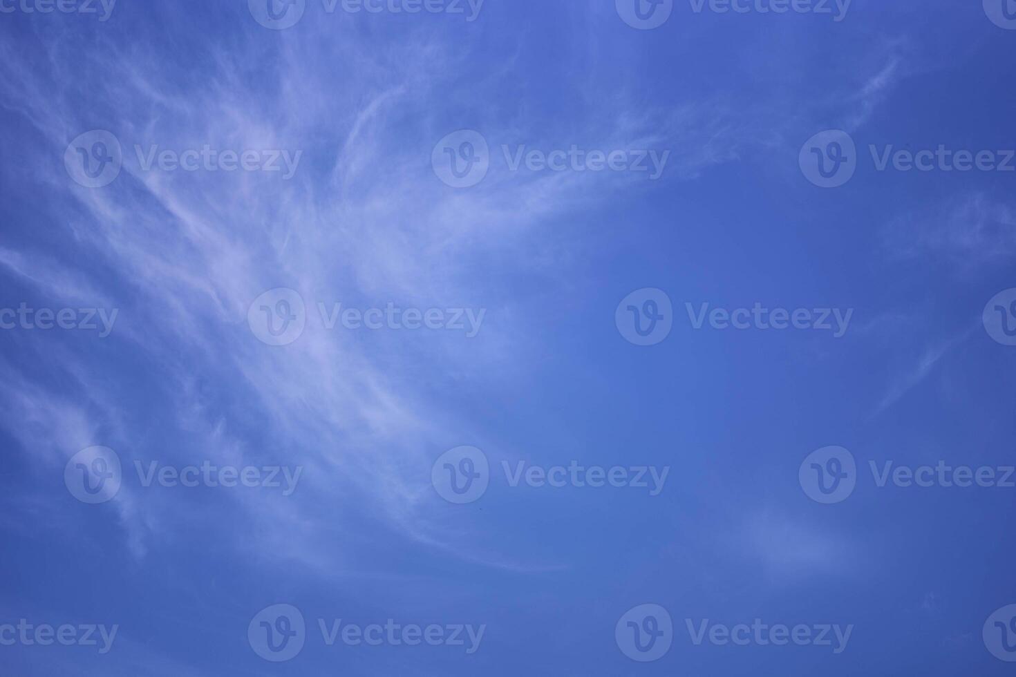 the sky on a summer day with white cirrus clouds photo