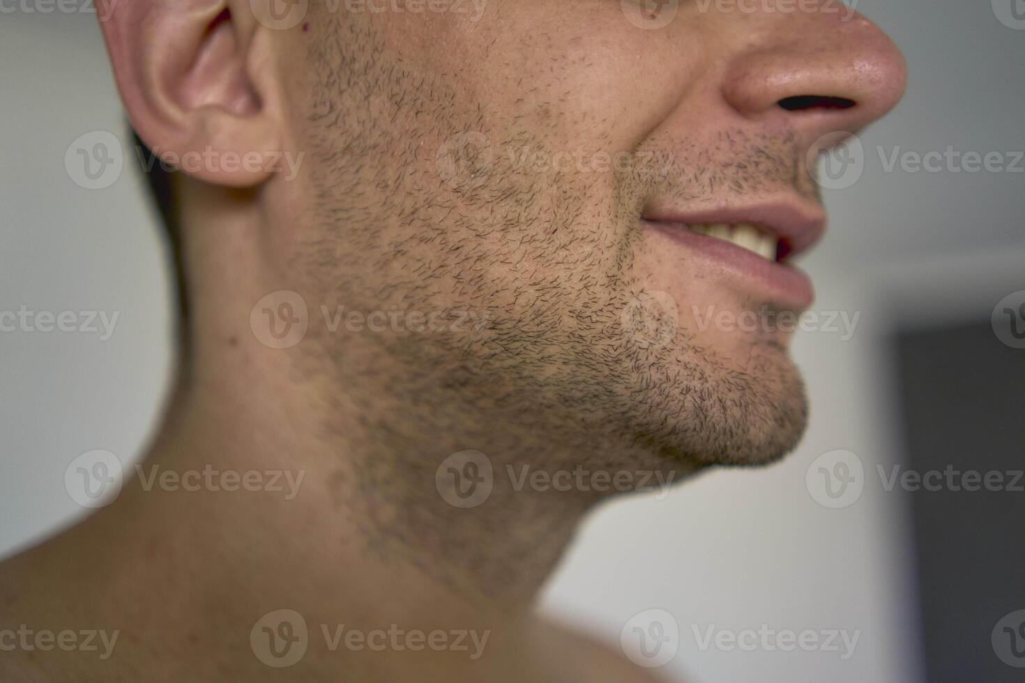 chin with bristles of a thirty-year-old man of a medium build photo