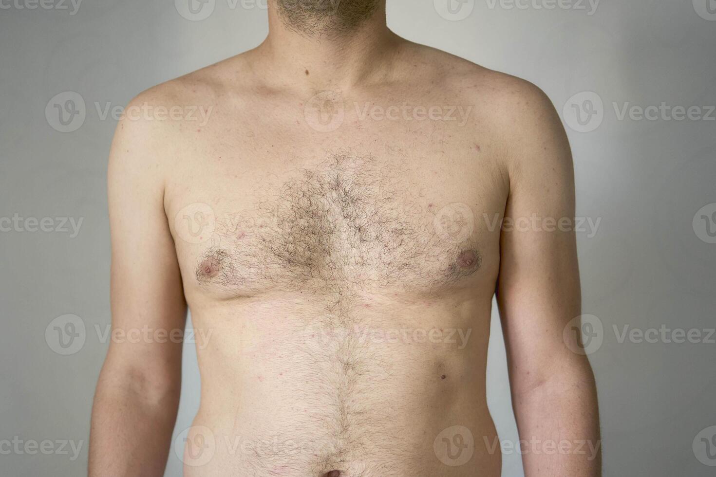 chest and stomach of a thirty-year-old with average build photo