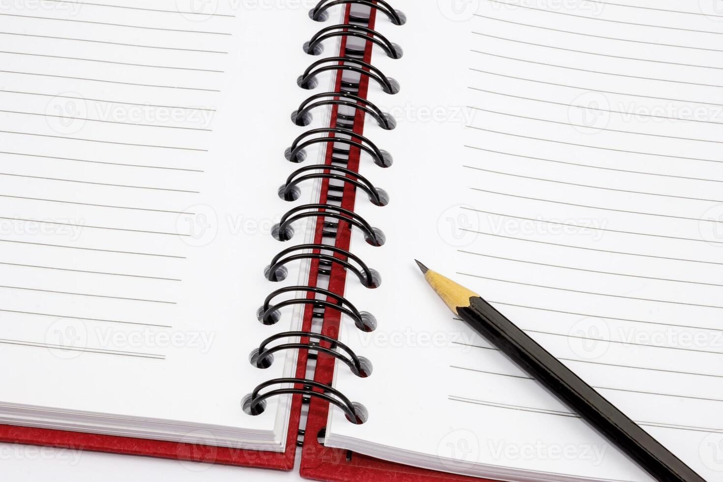 open notebook and pencil, top view photo