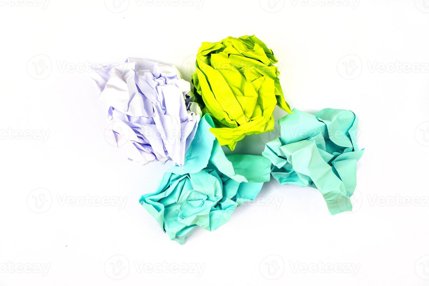 Crumpled and torn color papers, isolated on white photo