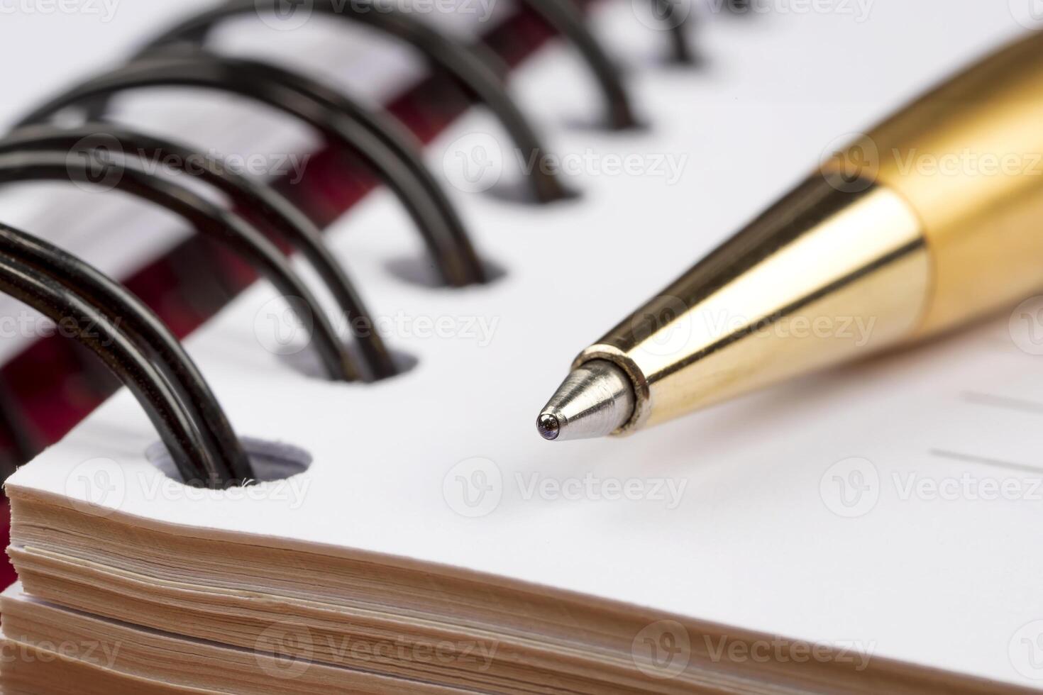 notebook and luxury pen close up with a blurred background photo