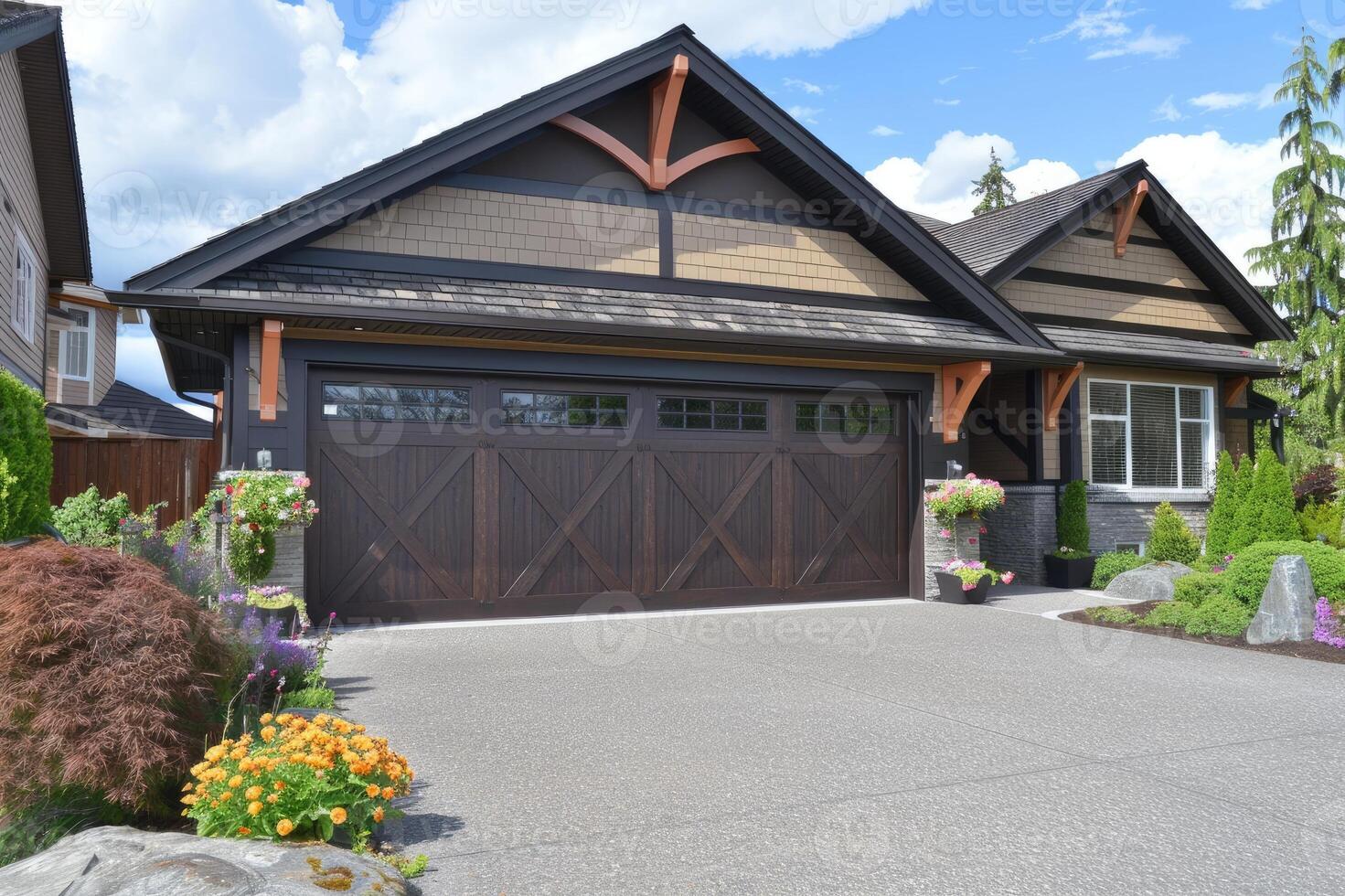 Garage door with a driveway in front. photo