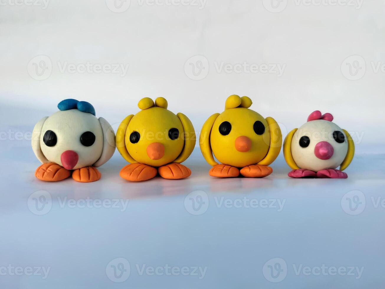 Set of Four Handmade Clay Plasticine Birds Minimalist On White Background - Clay Toys - Front Facing photo