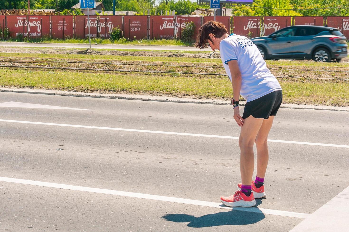 Belgrade, Serbia, April 28, 2024, 37th Belgrade Marathon Comtrade. People running a long distance marathon. Tired people runners looking for a second wind. photo