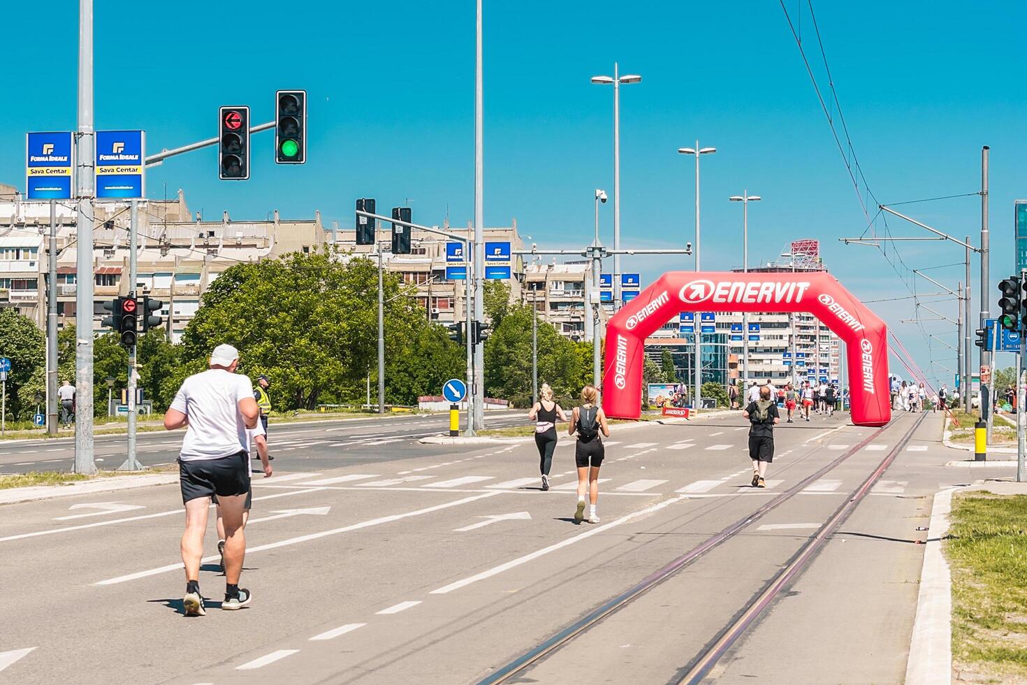 Belgrade, Serbia, April 28, 2024, 37th Belgrade Marathon Comtrade. People running a long distance marathon. Tired people runners looking for a second wind. photo