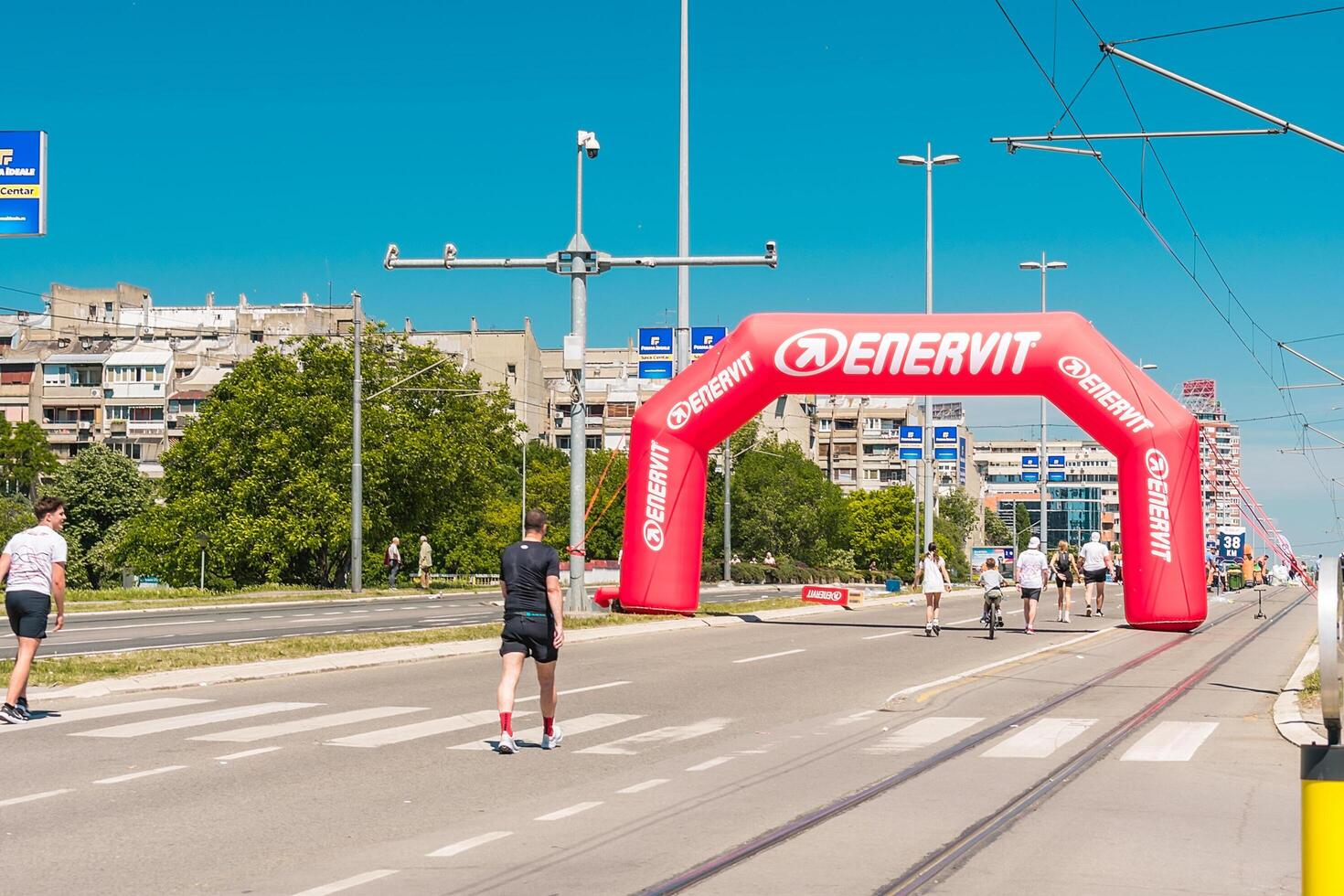 Belgrade, Serbia, April 28, 2024, 37th Belgrade Marathon Comtrade. People running a long distance marathon. Tired people runners looking for a second wind. photo