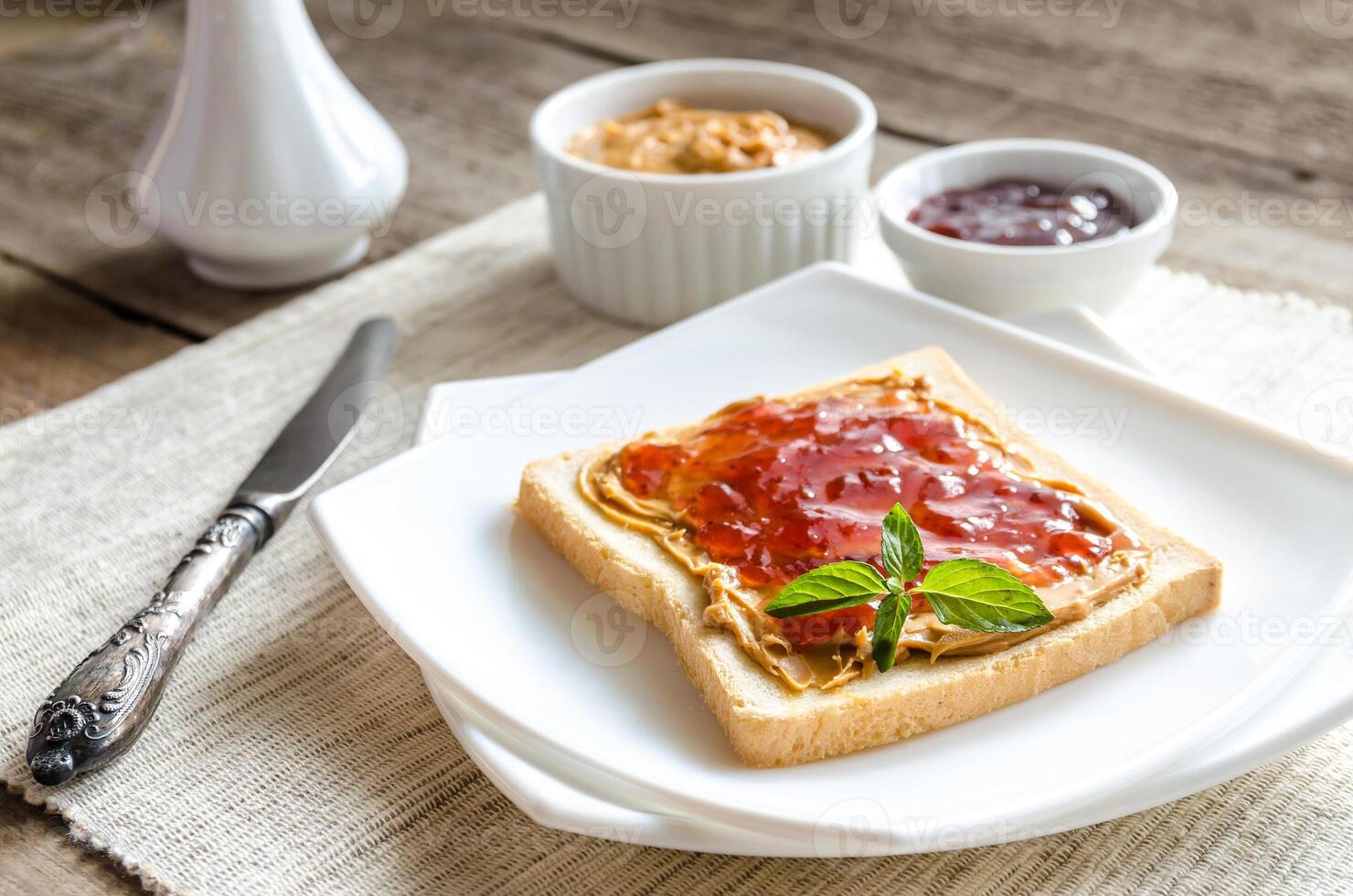Sandwich with peanut butter and strawberry jelly photo