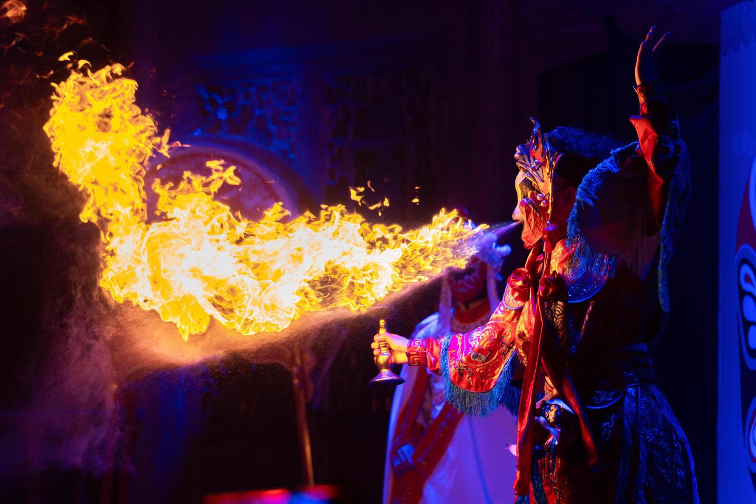 CHENGDU, CHINA - MAY 10, 2024 -Chinese actor performs a public traditional changing face performance onstage in Chengdu, China photo