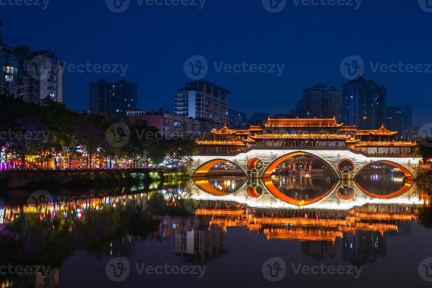 Night view of Anshun Lang Bridge with beautiful illumination and reflection in Chengdu, China photo