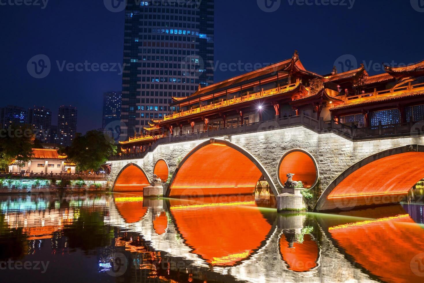Night view of Anshun Lang Bridge with beautiful illumination and reflection in Chengdu, China photo